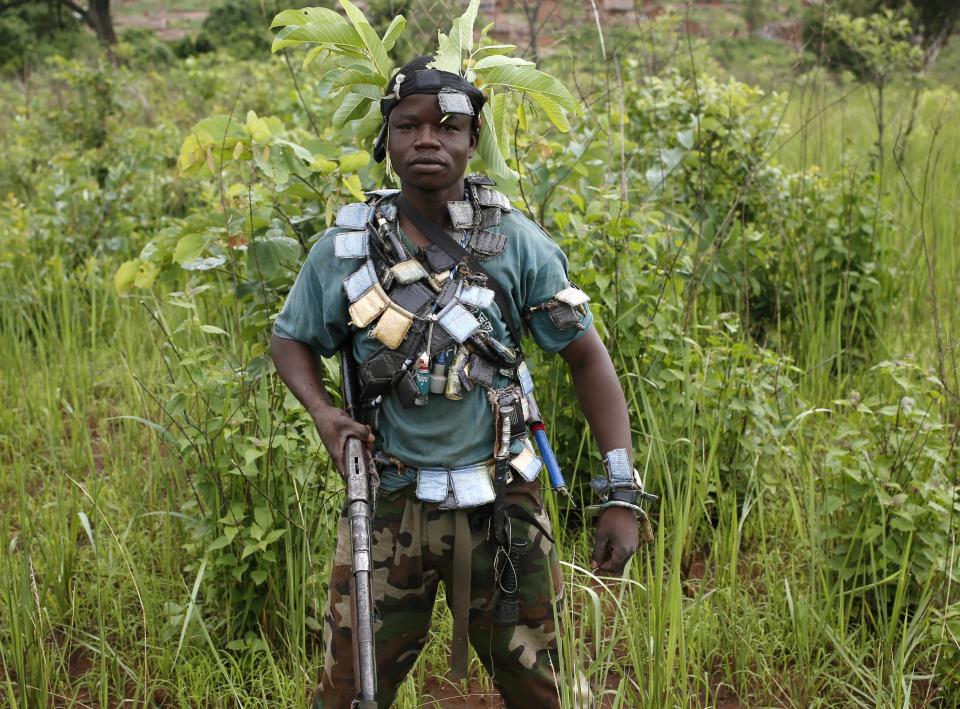 A member of the anti-balaka, a Christian militia, stands during a patrol outside the village of Zawa