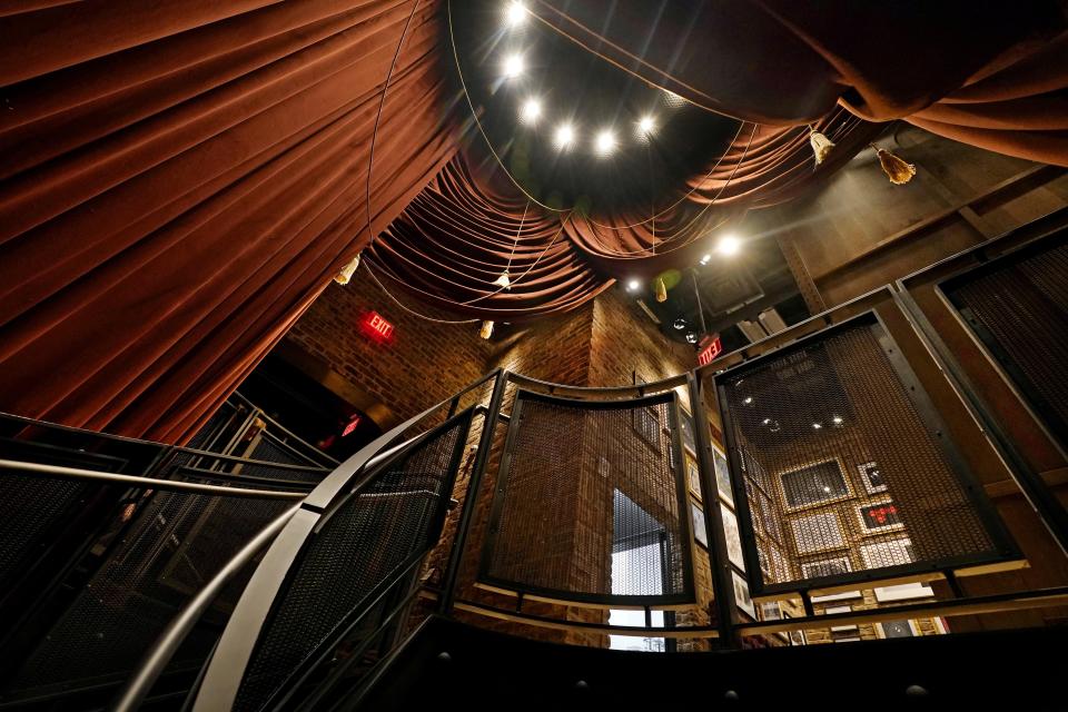 A spiral staircase connects the lobby and second floor of the Civilian hotel in New York's Theater District, Monday, Nov. 15, 2021. The 203-room hotel is packed with hundreds of pieces of Broadway art, including sketches, set models, costume pieces, photographs and artifacts that show theater past and present. (AP Photo/Richard Drew)