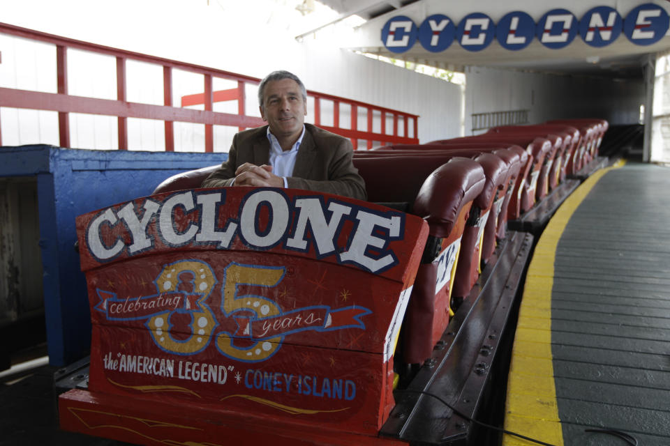 In a Tuesday, June 26, 2012 photo taken on Coney Island in New York,  Valerio Ferrari, President of Central Amusement International, is interviewed while sitting in the one of the Cyclone roller coaster cars.  (AP Photo/Mary Altaffer)