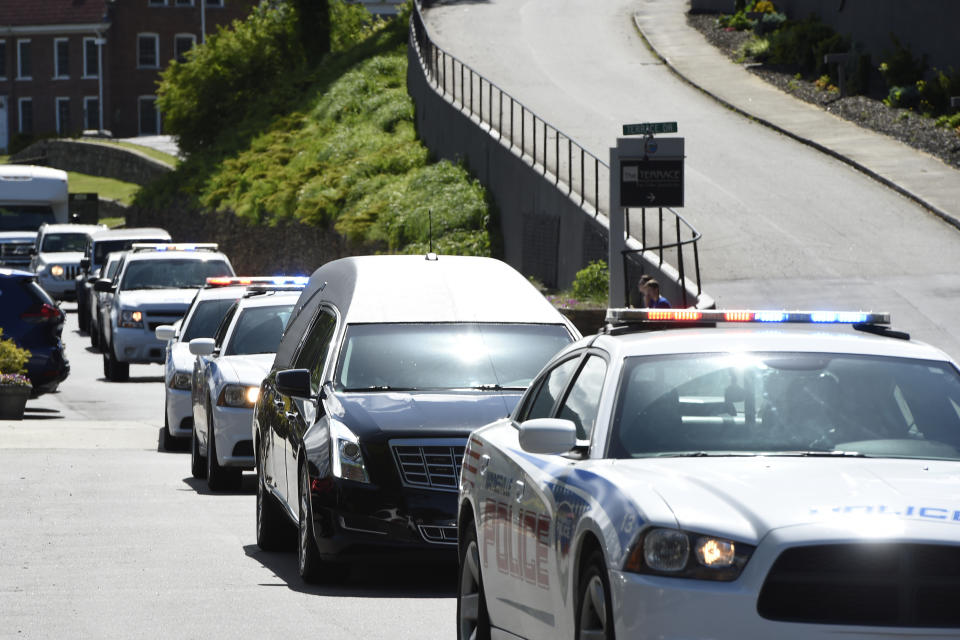 The hearse carrying the casket of Riley Howell arrives for his memorial service in Lake Junaluska, N.C., Sunday, May 5, 2019. Family, hundreds of friends and a military honor guard on Sunday remembered Howell, a North Carolina college student credited with saving classmates by rushing a gunman firing inside their lecture hall. (AP Photo/Kathy Kmonicek)