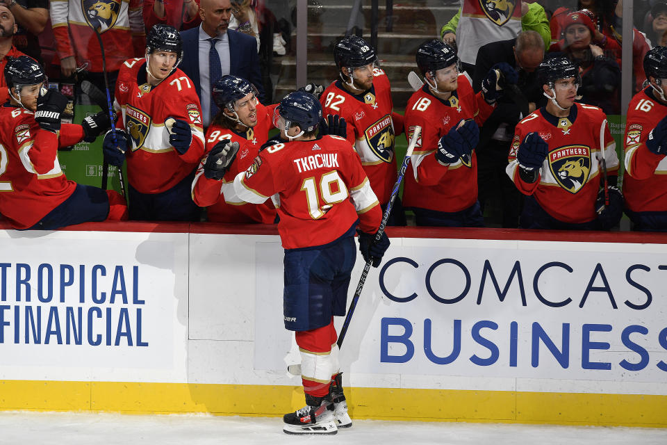 Florida Panthers left wing Matthew Tkachuk (19) celebrates scoring a goal with teammates during the second period of an NHL hockey game against the New York Islanders, Saturday, Dec. 2, 2023, in Sunrise, Fla. (AP Photo/Michael Laughlin)