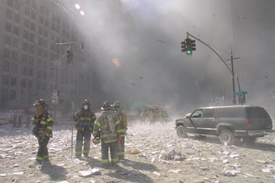 Emergency crews survey the damage after the fall of the twin towers on September 11, 2001 in New York City.