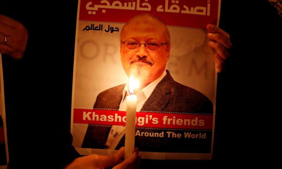 A demonstrator holds a poster with a picture of Saudi journalist Jamal Khashoggi outside the Saudi Arabia consulate in Istanbul, Turkey, on 25 October.