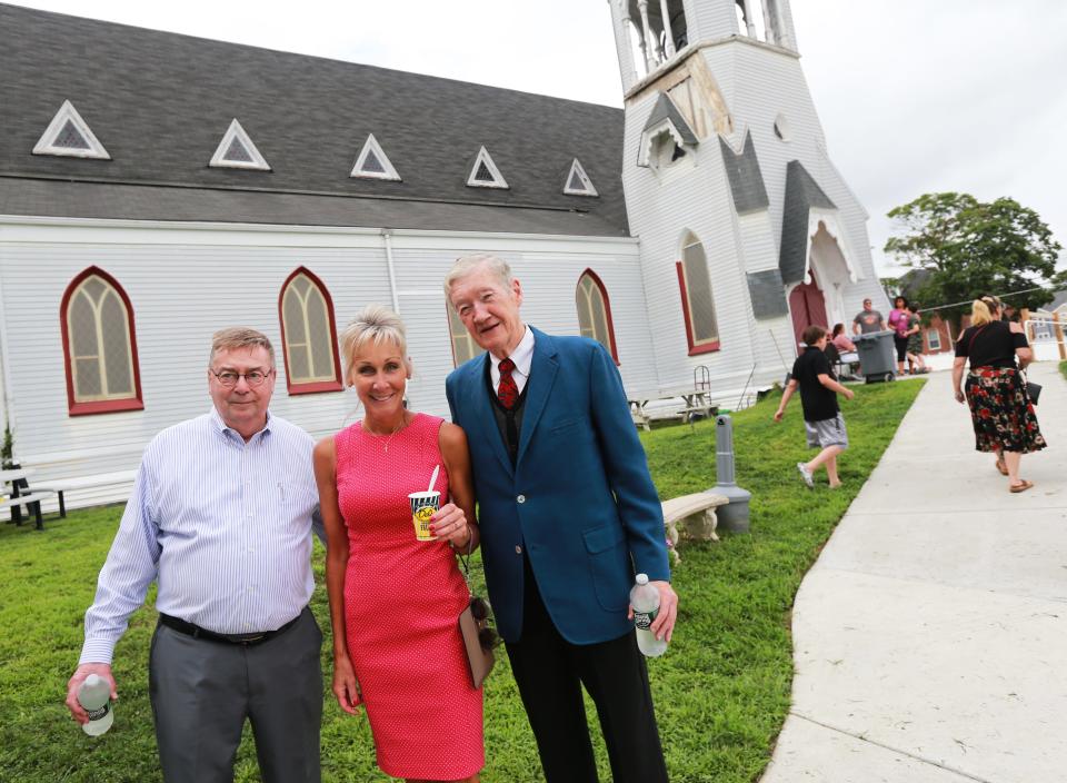 Taunton Mayor Shaunna O'Connell with Dan Foley and Peter Camerson, owners of Reed and Barton in Taunton, at the Whittenton Block Party at the Broken Chains Biker Church on Thursday, Aug. 11, 2022.  