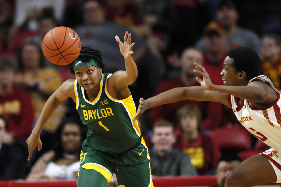 Baylor forward NaLyssa Smith fights for the ball with Iowa State forward Inès Nezerwa, right, during the second half of an NCAA college basketball game, Sunday, March 8, 2020, in Ames, Iowa. (AP Photo/Charlie Neibergall)