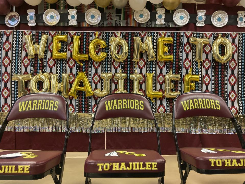 This Feb. 17, 2023 image shows chairs lining the stage for a celebration in the Navajo community of To'Hajiilee, New Mexico. To'Hajiilee Community School is just one of dozens funded by the U.S. Bureau of Indian Education that are in desperate need of repair or replacement. More than $90 million has been secured in the latest federal budget to build a new campus. (AP Photo/Susan Montoya Bryan)