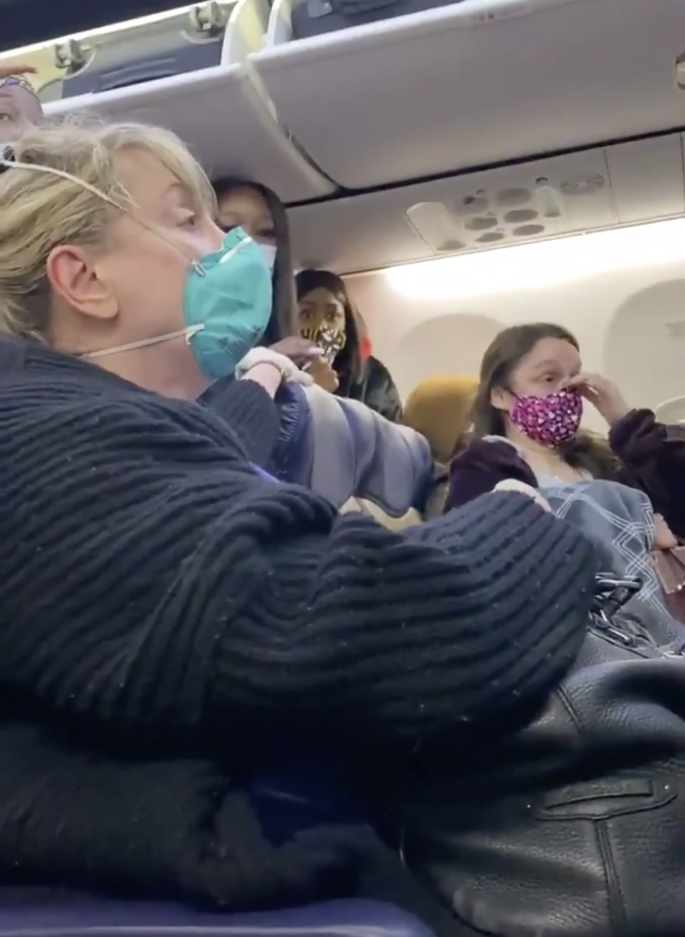 Woman seated on Southwest Airline plane.