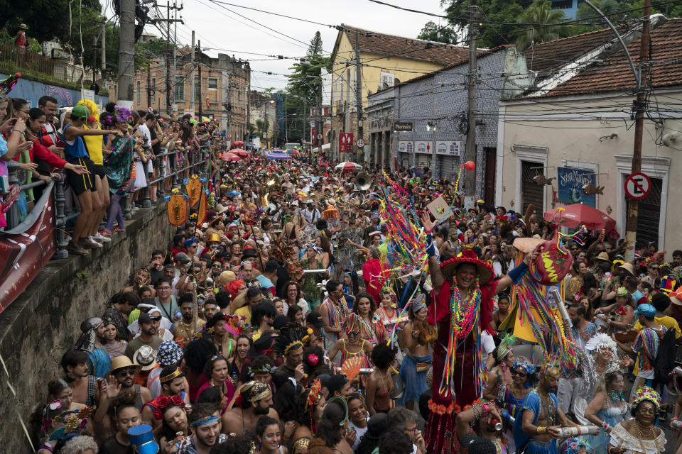 Revelers perform at the "Ceu na Terra" or Heaven on Earth street party in Rio de Janeiro, Brazil, Saturday, Feb. 22, 2020. From very early in the morning revelers take the streets of the bohemian neighborhood Santa Teresa for one of the many block parties during the Carnival celebrations in the city. (AP Photo/Leo Correa)