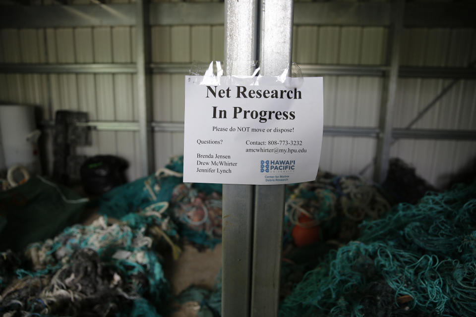 Ghost nets and other debris sit in a shed at Hawaii Pacific University's Center for Marine Debris Research on Wednesday, May 12, 2021 in Kaneohe, Hawaii. Researchers are conducting a study that is attempting to trace derelict fishing gear that washes ashore in Hawaii back to the manufacturers and fisheries that it came from. (AP Photo/Caleb Jones)