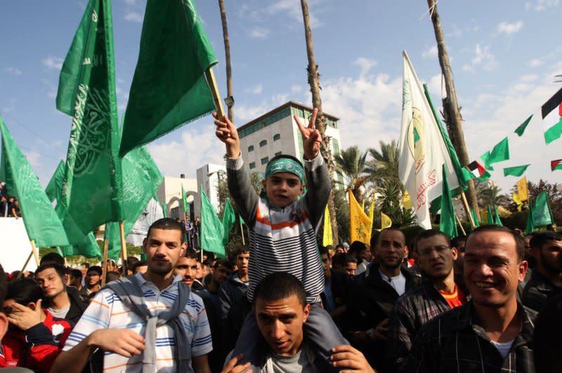 Palestinians celebrate the Israel-Hamas cease-fire in Gaza City on November 22, 2012, a day after it was declared. The Egypt-brokered truce took hold in the Gaza Strip after a week of bitter fighting between militant groups and Israel, with both sides claiming victory but remaining wary. File Photo by Ismael Mohamad/UPI