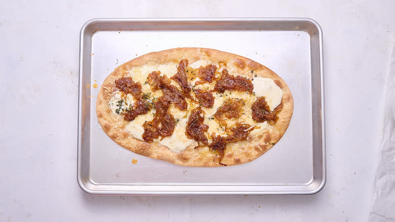 baked flatbread pizza on sheet tray