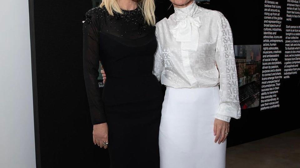 Donatella Versace in black with Geri Halliwell Horner in white