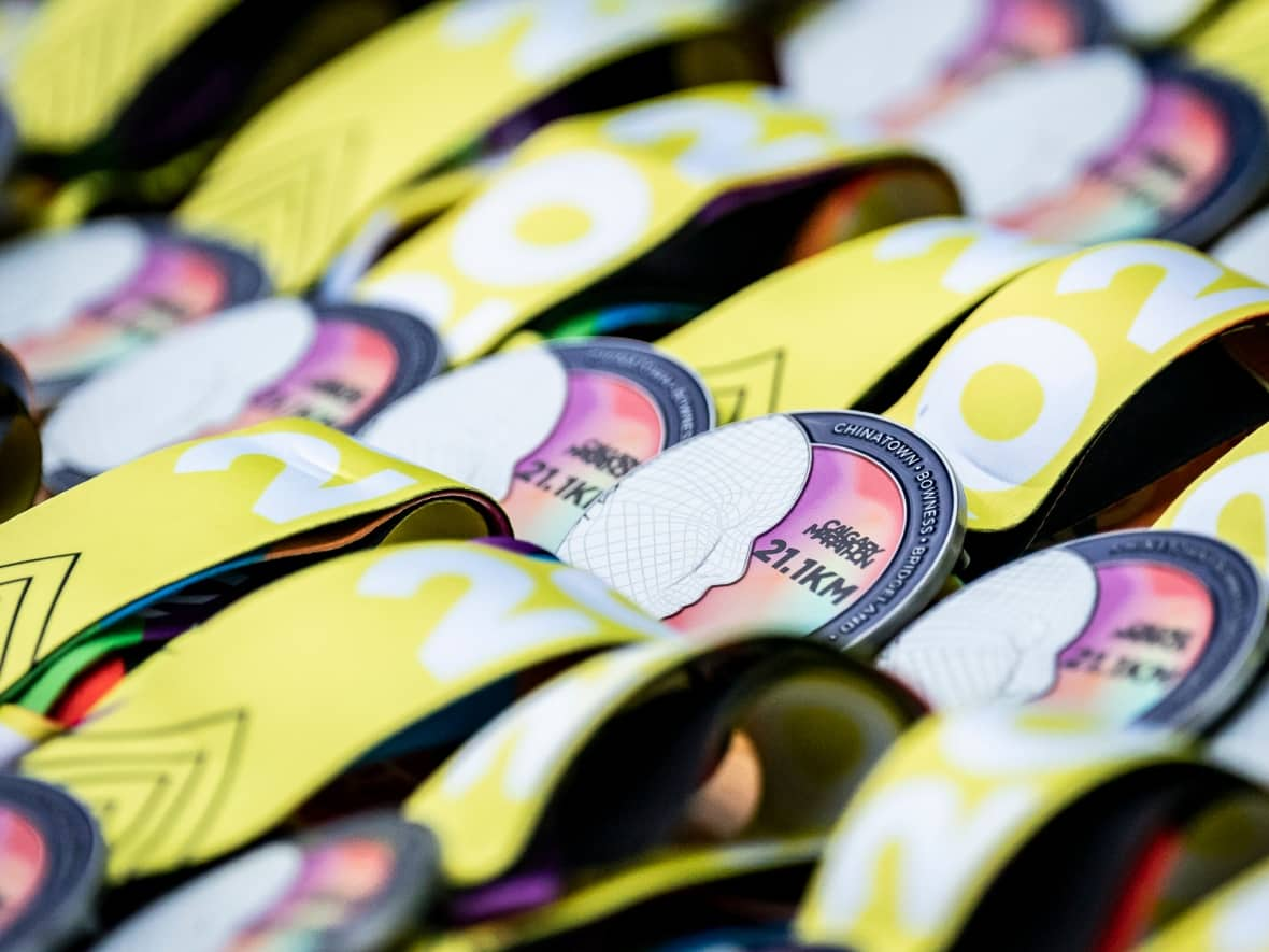 These medals, handed out to participants in the 2022 Calgary Marathon, almost didn't make it to the finish line in time due to supply-chain issues. (Dave Holland/Run Calgary - image credit)