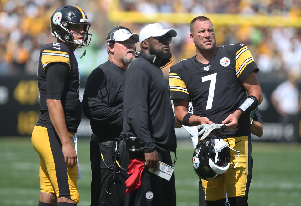 Sep 15, 2019; Pittsburgh, PA, USA;  Pittsburgh Steelers quarterback Mason Rudolph (2) and offensive coordinator Randy Fichtner (left middle) and head coach Mike Tomlin (right middle) and quarterback Ben Roethlisberger (7) watch a scoreboard replay against the Seattle Seahawks during the second quarter at Heinz Field. Mandatory Credit: Charles LeClaire-USA TODAY Sports