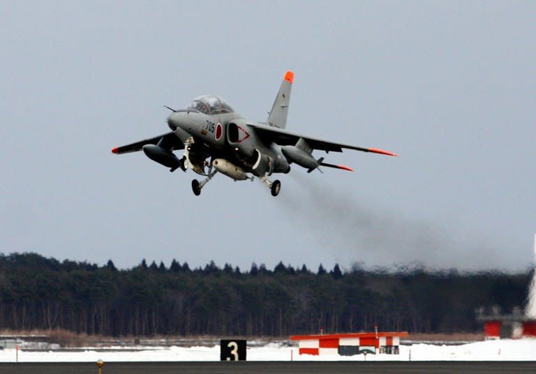 Image taken by Japan's Defense Ministry on February 12, 2013 shows an Air Self-Defense Force aircraft taking off from Aomori prefecture to collect atmospheric samples in the wake of North Korea's nuclear test. Efforts to find out the type of device detonated appeared to be getting nowhere Thursday, with South Korean experts unable to detect any radioactive fallout