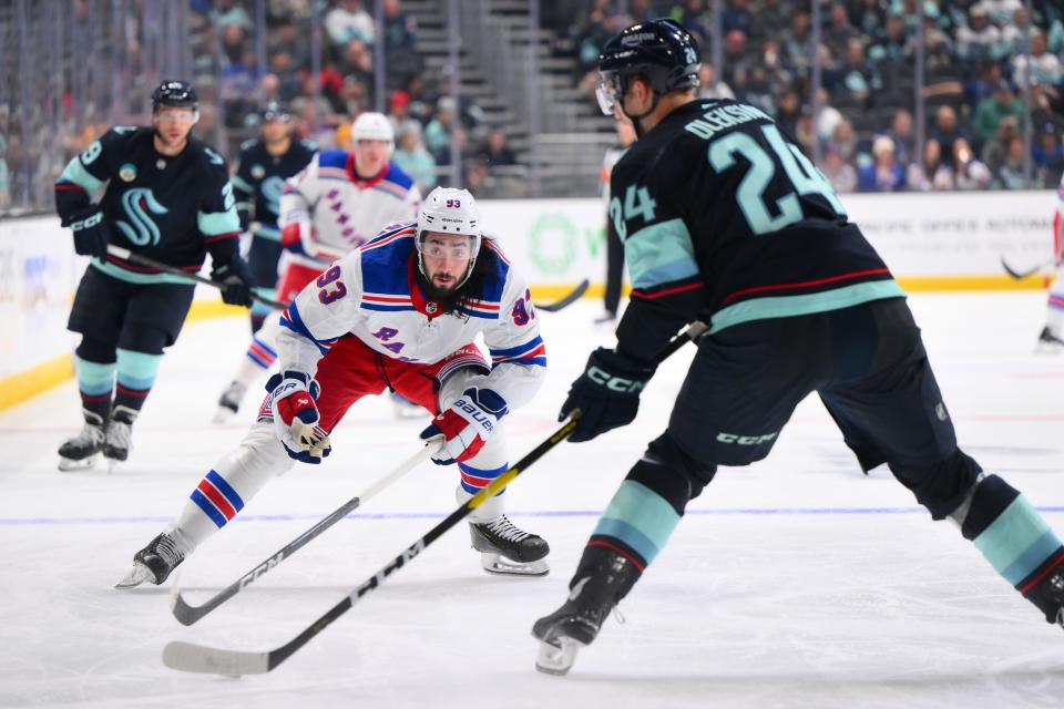 Oct 21, 2023; Seattle, Washington, USA; New York Rangers center Mika Zibanejad (93) guards Seattle Kraken defenseman Jamie Oleksiak (24) during the third period at Climate Pledge Arena.