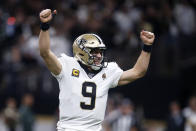 New Orleans Saints quarterback Drew Brees (9) celebrates a touchdown carry by Alvin Kamara in the first half of an NFL wild-card playoff football game against the Minnesota Vikings, Sunday, Jan. 5, 2020, in New Orleans. (AP Photo/Butch Dill)