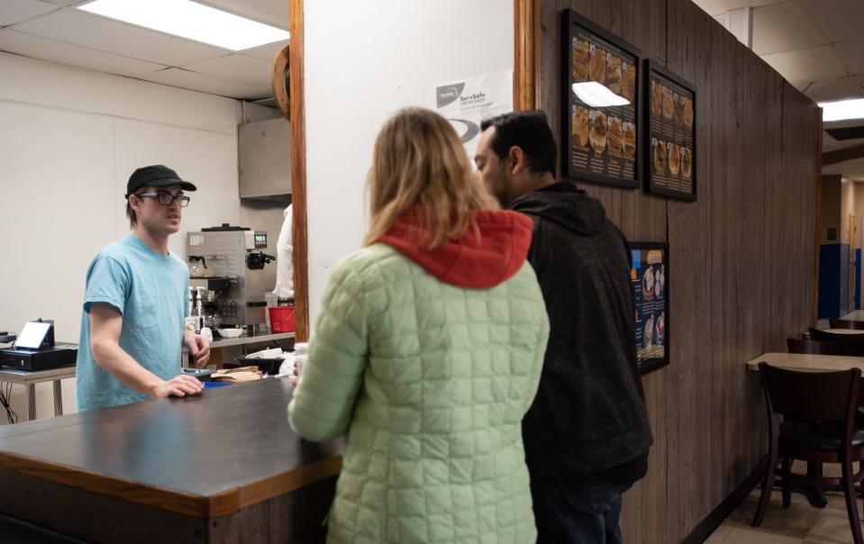 Elsa's Chicken & Waffles owner Nick Travelbee chats with guests Wednesday, May 3, 2023, at his new restaurant near Jolly and Waverly roads in Lansing.
