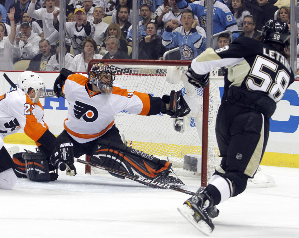 PITTSBURGH, PA - APRIL 13: Ilya Bryzgalov #30 of the Philadelphia Flyers makes a glove save on Kris Letang #58 of the Pittsburgh Penguins in Game Two of the Eastern Conference Quarterfinals during the 2012 NHL Stanley Cup Playoffs at Consol Energy Center on April 13, 2012 in Pittsburgh, Pennsylvania. (Photo by Justin K. Aller/Getty Images)