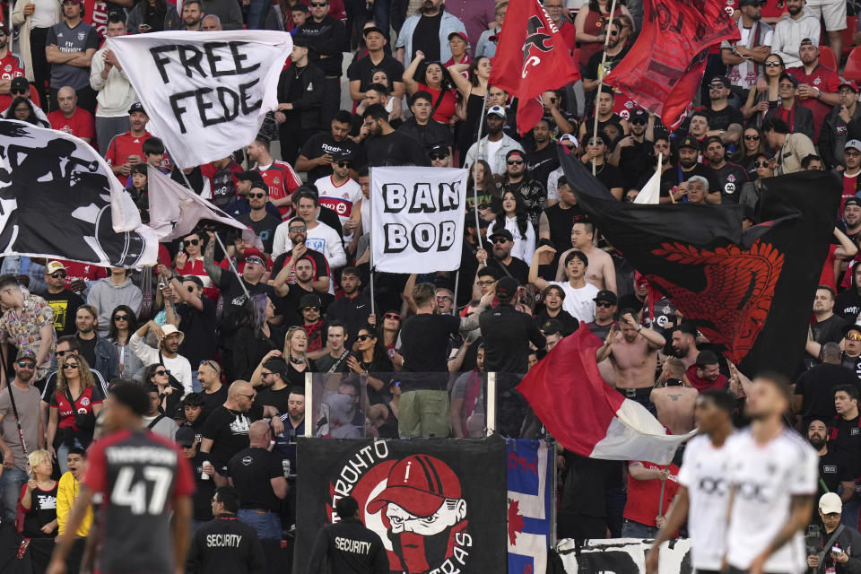 Toronto FC fans wave banners commenting on the current turmoil at the club during first-half MLS soccer match action against D.C. United in Toronto, Ontario, Saturday, May 27, 2023. (Chris Young/The Canadian Press via AP)