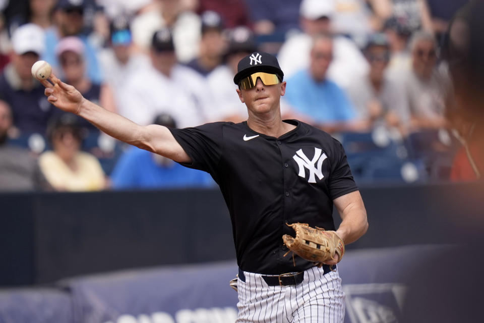 New York Yankees third baseman DJ LeMahieu throws out Boston Red Sox's Dalton Guthrie at first base in the third inning of a spring training baseball game Wednesday, March 13, 2024, in Tampa, Fla. (AP Photo/Charlie Neibergall)