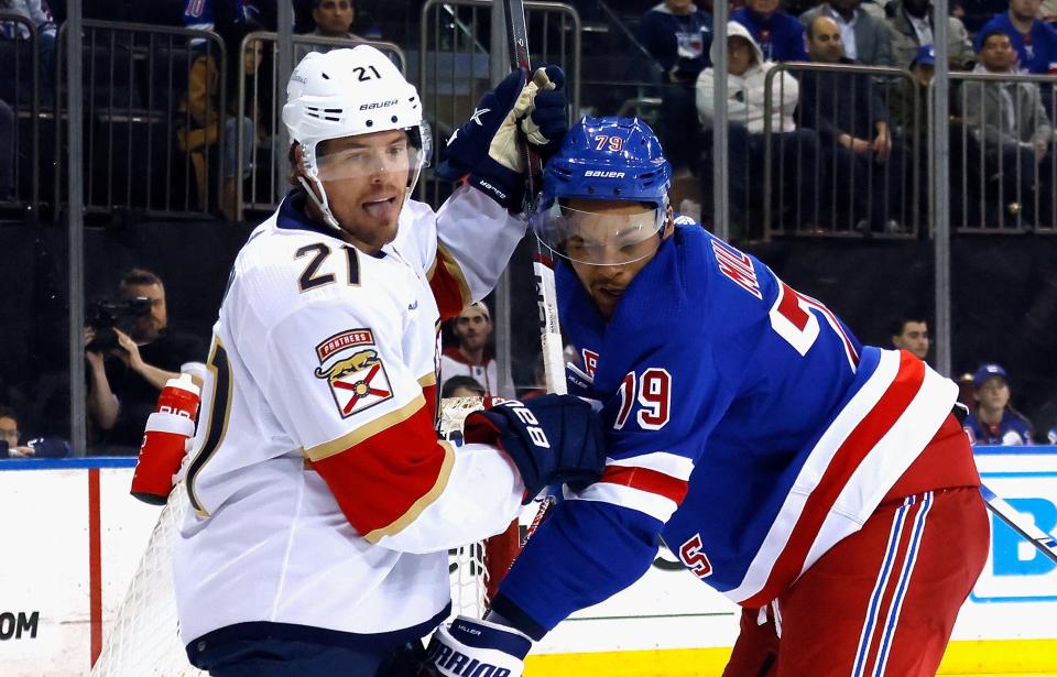 NEW YORK, NEW YORK - MARCH 04: Nick Cousins #21 of the Florida Panthers gets the stick up on K'Andre Miller #79 of the New York Rangers during the third period at Madison Square Garden on March 04, 2024 in New York City. The Panthers defeated the Rangers 4-2.