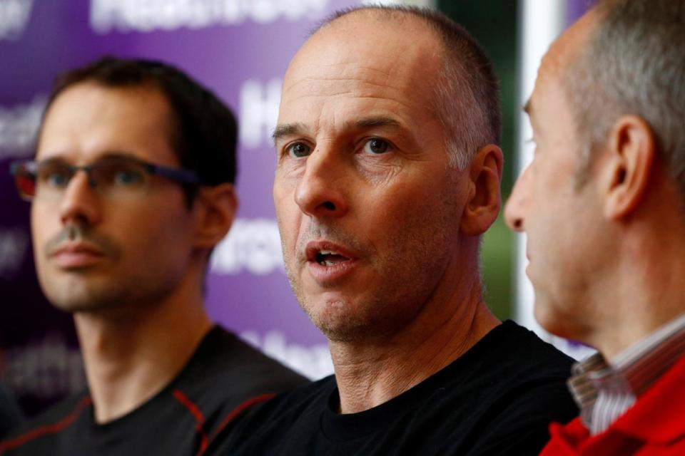 British cave divers, Rick Stanton (centre), Chris Jewell (left), and Chairman of the British Cave Rescue Council Peter Dennis speak to the media at a news conference at Heathrow Airport, having helped in the rescue of the 12 boys in Thailand, in London (REUTERS)