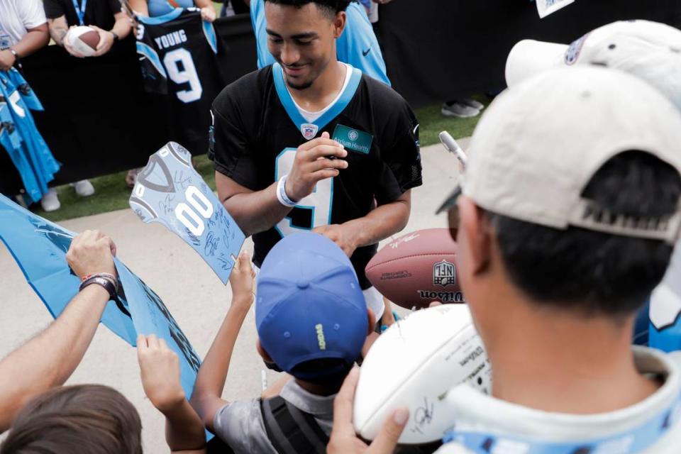 Carolina Panthers quarterback, Bryce Young, signs autographs with fans after a Training Camp practice on Saturday, July 29, 2023.