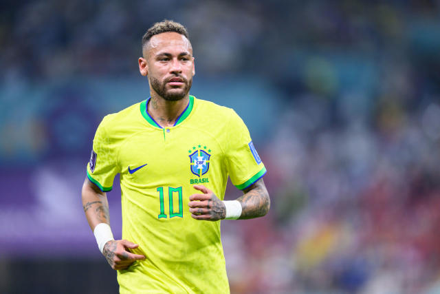 Brazilian football star Neymar, or Neymar Jr., poses as he arrives