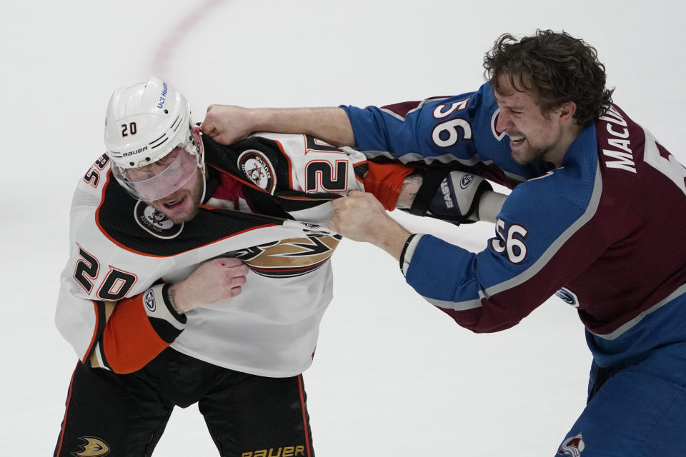 Anaheim Ducks left wing Nicolas Deslauriers, left, and Colorado Avalanche defenseman Kurtis MacDermid fight during the first period of an NHL hockey game Wednesday, Jan. 19, 2022, in Anaheim, Calif. (AP Photo/Mark J. Terrill)