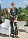 <p>Slippers (by <span>Louise et Cie)</span>, silk pajamas, and sparking rose? Karolina Kurkova is doing it so right?</p> <h4>Getty Images</h4>