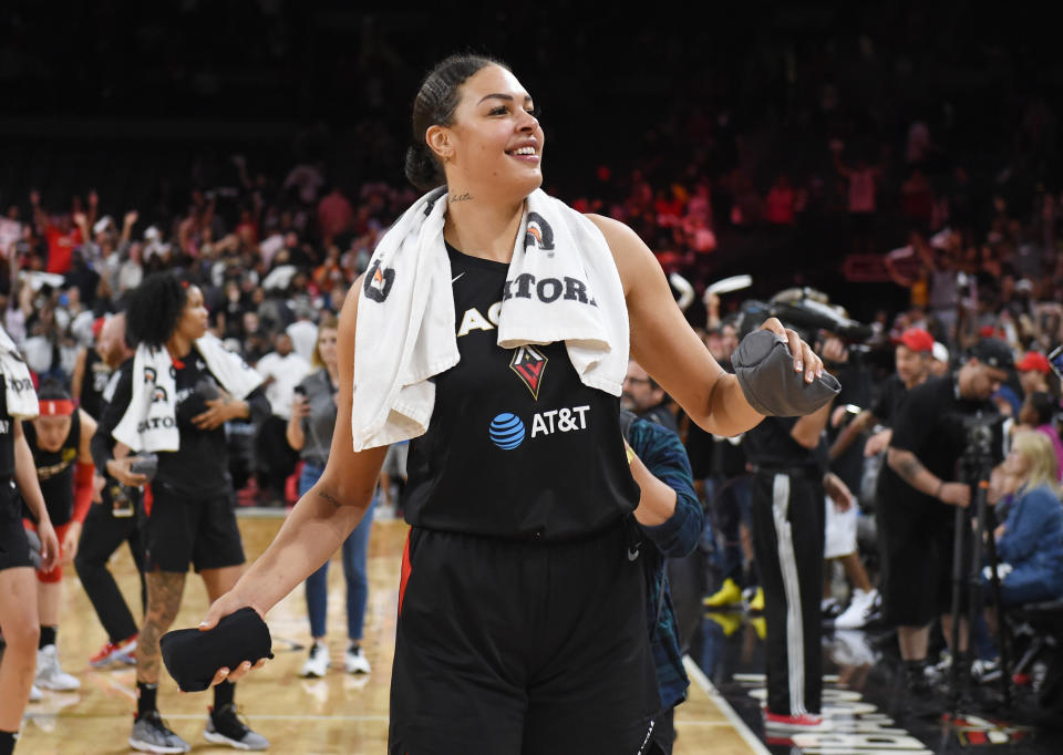 LAS VEGAS, NEVADA - SEPTEMBER 22:  Liz Cambage #8 of the Las Vegas Aces throws T-shirts to the crowd after the Aces beat the Washington Mystics 92-75 in Game Three of the 2019 WNBA Playoff semifinals at the Mandalay Bay Events Center on September 22, 2019 in Las Vegas, Nevada. NOTE TO USER: User expressly acknowledges and agrees that, by downloading and or using this photograph, User is consenting to the terms and conditions of the Getty Images License Agreement.  (Photo by Ethan Miller/Getty Images)