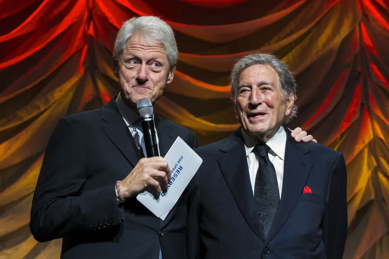 Former U.S. President Bill Clinton stands with singer Tony Bennett during the Clinton Global Citizen award ceremony at the Clinton Global Initiative's annual meeting in New York