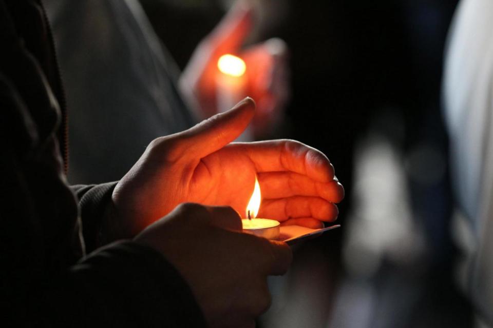 Candles are lit at the 100 days vigil for the Grenfell Tower fire (PA)