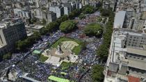 People rally outside Congress during a national strike against the economic and labor reforms proposed by Argentine President Javier Milei's government in Buenos Aires, Argentina, Wednesday, Jan. 24, 2024. (AP Photo/Rodrigo Abd)