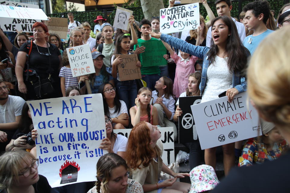 Swedish environmental activist Greta Thunberg, lower center, participates in a Youth Climate Strike outside the United Nations, Friday, Aug. 30, 2019 in New York. Thunberg is scheduled to address the United Nations Climate Action Summit on September 23. (AP Photo/Mary Altaffer)