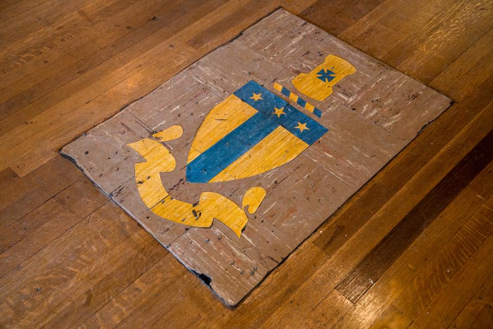A symbol for a fraternity is fixed to the floor at Little Bird Bakeshop on Wednesday, March 29, 2023, in Fort Collins. The bakery reopened in a new location in the former Canino's and discovered the insignia during renovations.