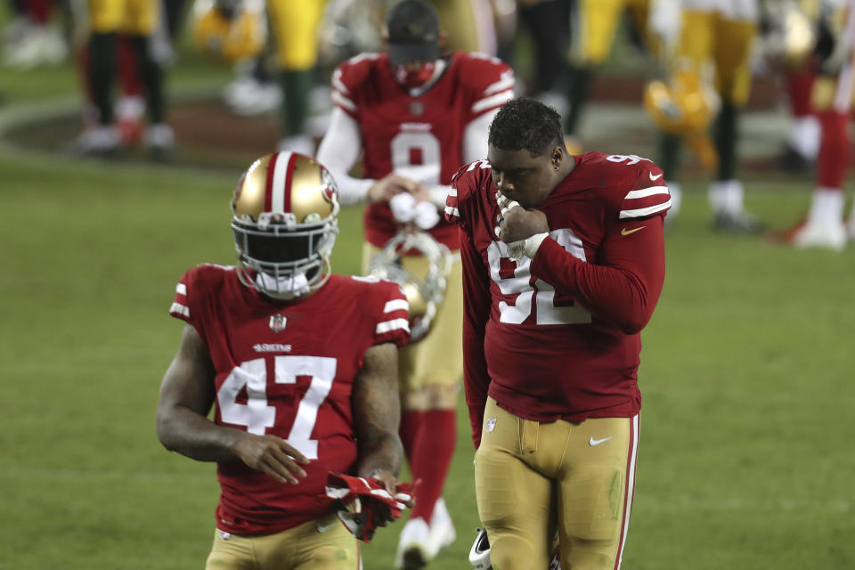 San Francisco 49ers cornerback Jamar Taylor (47) and defensive end Kerry Hyder Jr. (92) walk off the field after ther 49ers lost to the Green Bay Packers in an NFL football game in Santa Clara, Calif., Thursday, Nov. 5, 2020. (AP Photo/Jed Jacobsohn)