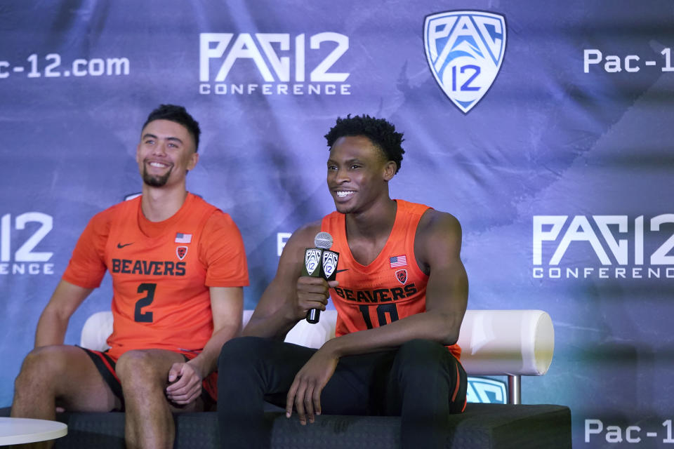 Oregon State's Warith Alatishe, right, speaks next to Jarod Lucas during the Pac-12 Conference NCAA college basketball media day Wednesday, Oct. 13, 2021, in San Francisco. (AP Photo/Jeff Chiu)