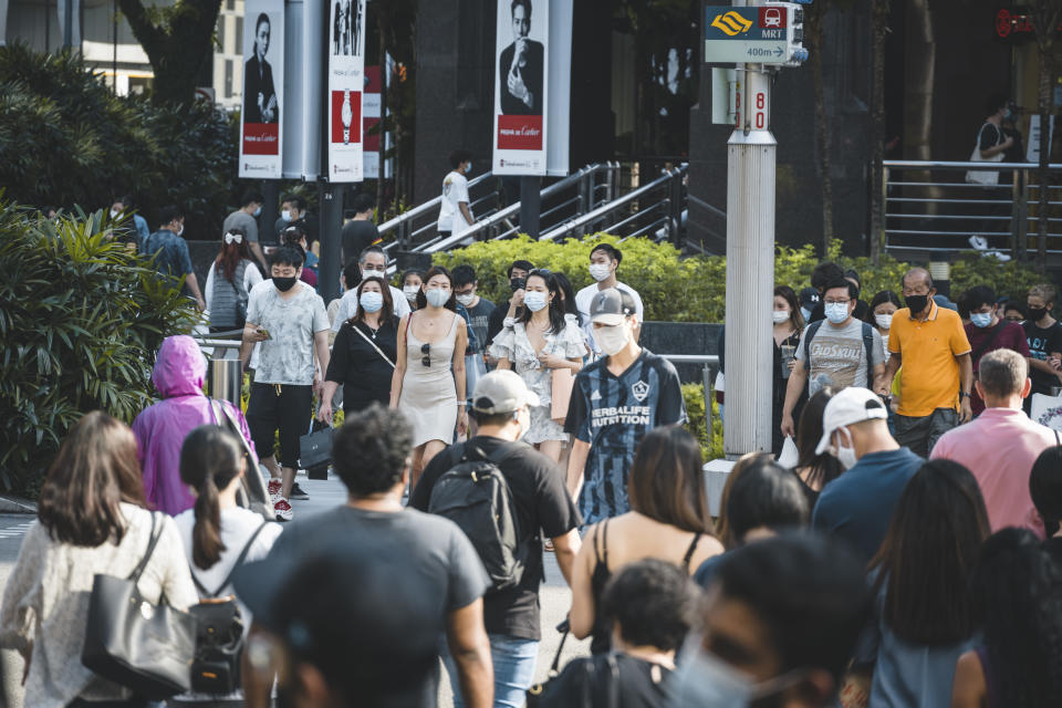 The Orchard Road crossing in Singapore is one of the busiest in the world, here seen an afternoon during the Covid-19 corona pandemics in October 2020. All people wearing masks to protect themselves.