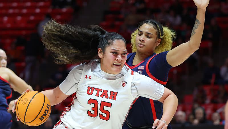 Utah forward Alissa Pili moves around Arizona Wildcats forward Esmery Martinez during a game at the Huntsman Center in Salt Lake City on Jan. 15, 2023. Utah prevailed, 80-79, thanks in part to some late-game heroics by Pili.