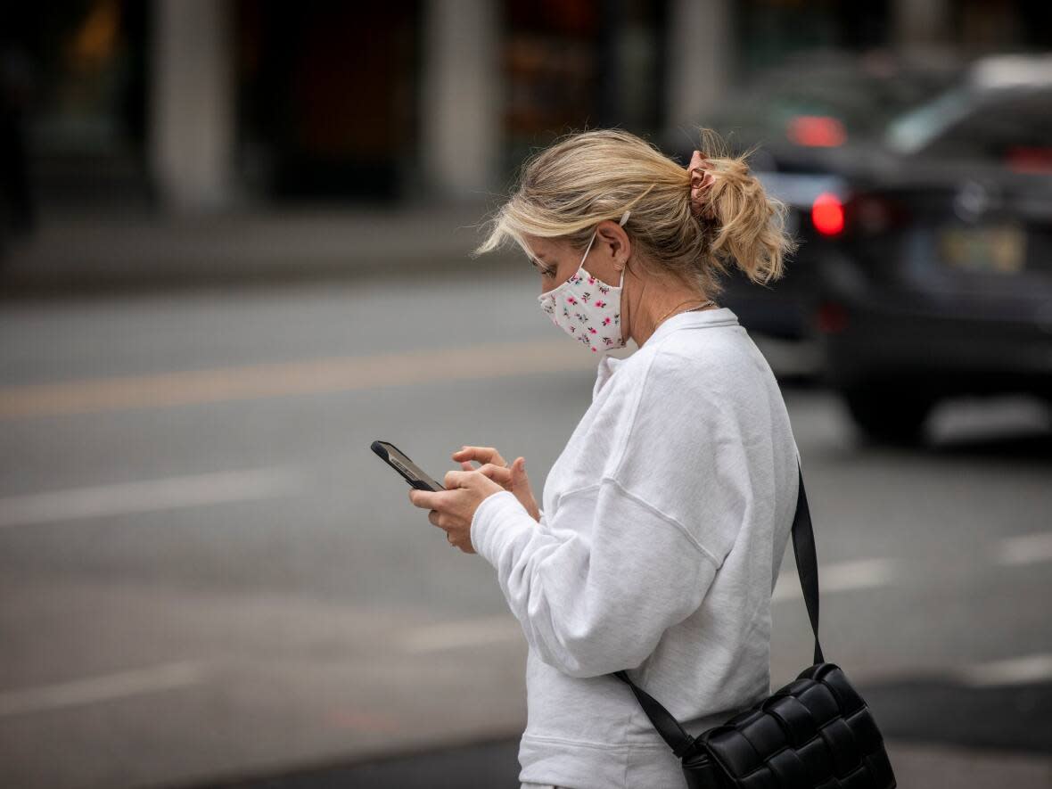 A pedestrian in downtown Vancouver on Oct. 4, 2021.  (Ben Nelms/CBC - image credit)