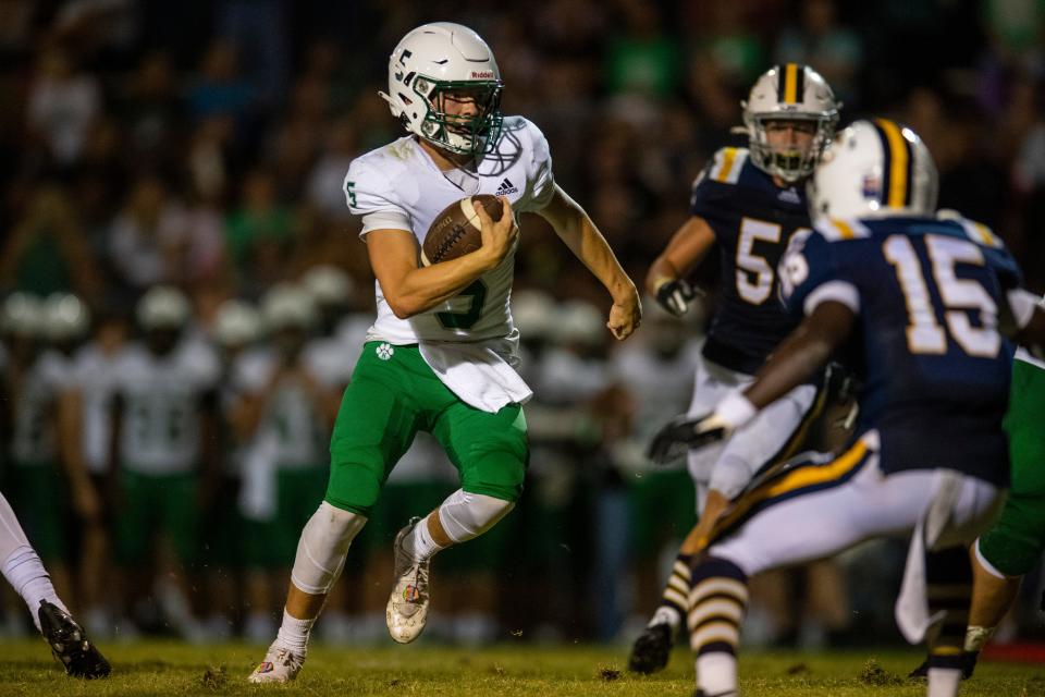 North’s Sam McKinney (5) carries the ball as the Castle Knights play the North Huskies at John Lidy Field in Newburgh, Ind., Friday, Aug. 18, 2023.