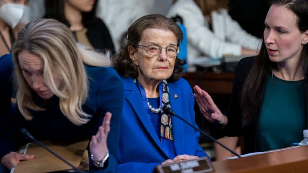 PHOTO: Sen. Dianne Feinstein, D-Calif., is flanked by aides as she returns to the Senate Judiciary Committee following a more than two-month absence as she was being treated for a case of shingles, at the Capitol in Washington, May 11, 2023. (J. Scott Applewhite/AP)