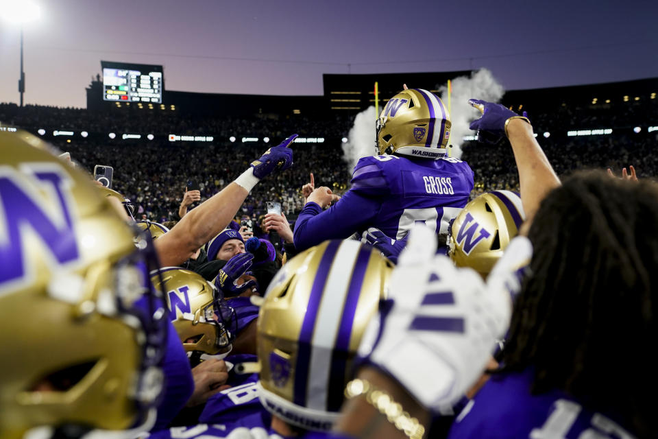 Washington place-kicker Grady Gross is lifted by win over Washington State in an NCAA college football game Saturday, Nov. 25, 2023, in Seattle. (AP Photo/Lindsey Wasson)