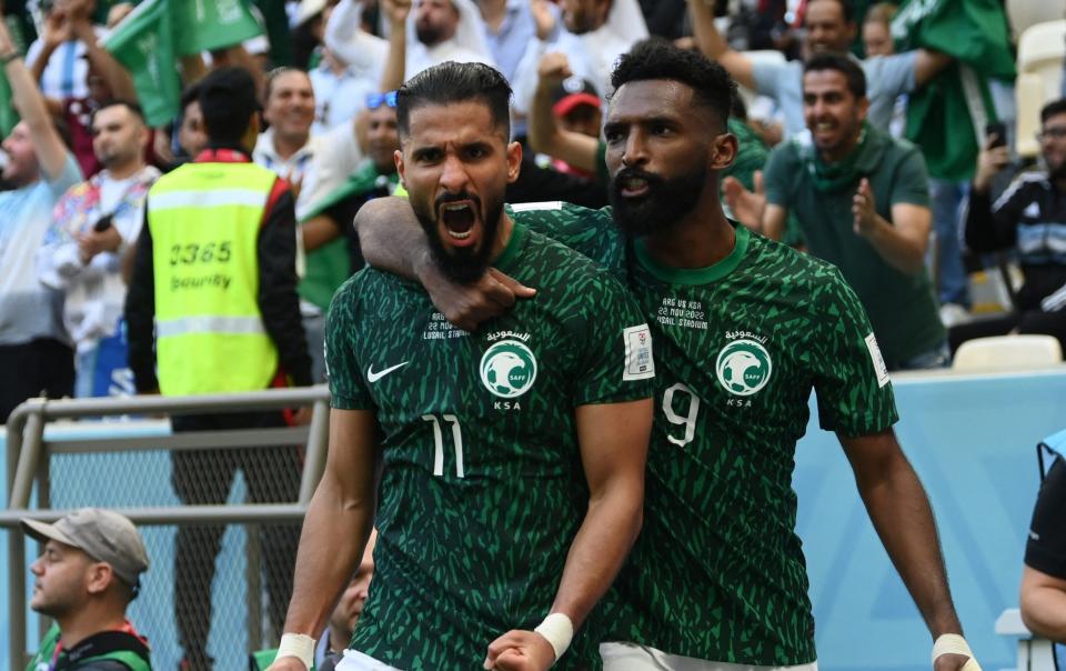 Saudi Arabia's Saleh Al-Shehri celebrates scoring their first goal with Feras Al Brikan - REUTERS/Annegret Hilse