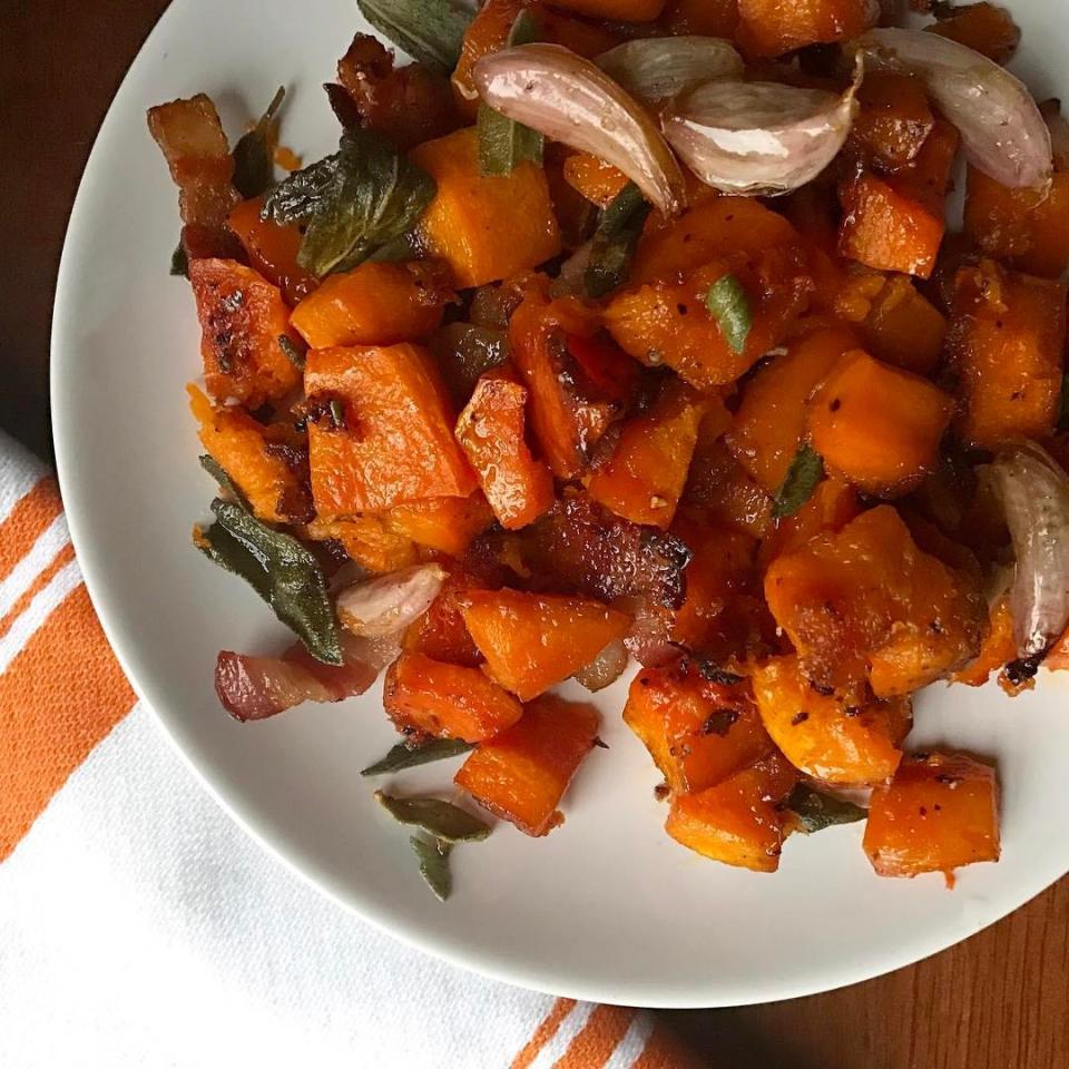 Cubes of maple-roasted butternut squash in a white dish