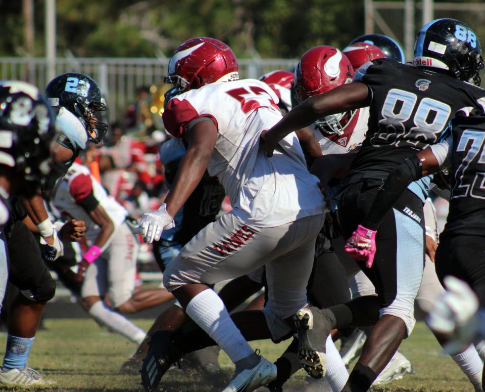 Raines defensive lineman Rashaud Fields (53) breaks through the line into the Ribault backfield during high school football's Northwest Classic on Oct. 23, 2021.