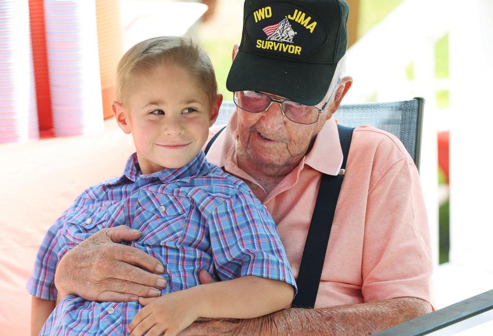 James Kimose, Farr West, talks with his great-great grandson Tad Fox, 5, as he celebrates his 101st birthday in Ogden on Sunday. Kimose is a WWII marine veteran and fought at Iwo Jima.