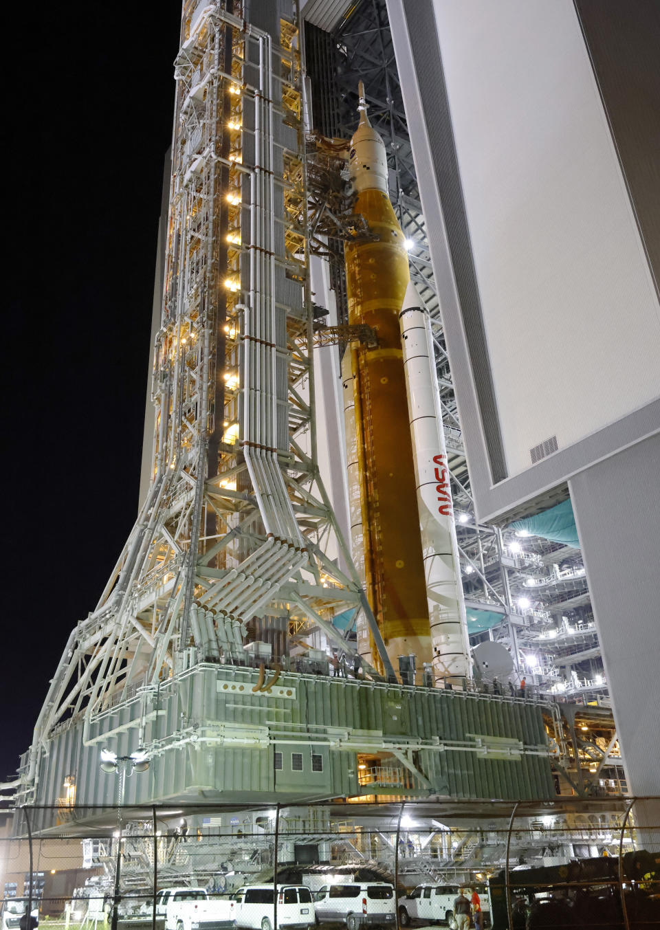 The NASA Artemis rocket with the Orion spacecraft aboard leaves the Vehicle Assembly Building moving slowly to pad 39B at the Kennedy Space Center in Cape Canaveral, Fla., Tuesday, Aug. 16, 2022. NASA is aiming for an Aug. 29 liftoff for the lunar test flight. (AP Photo/Terry Renna)